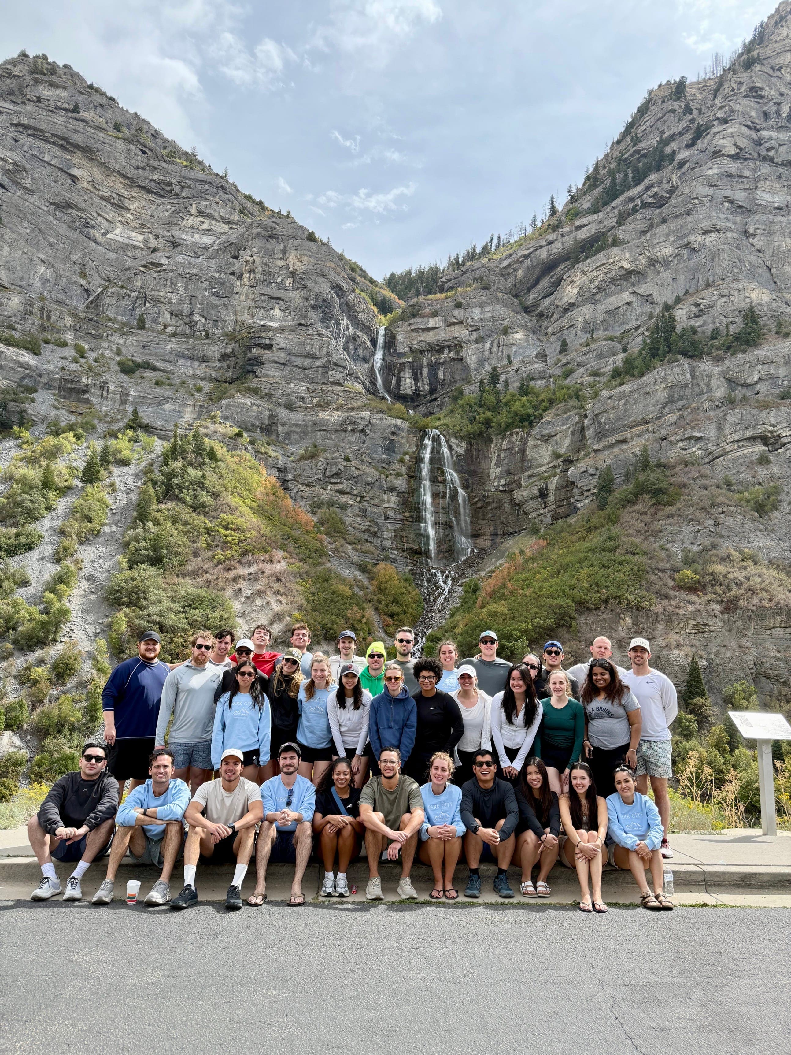 The whole company gathered below Bridal Veil Falls on the annual offsite